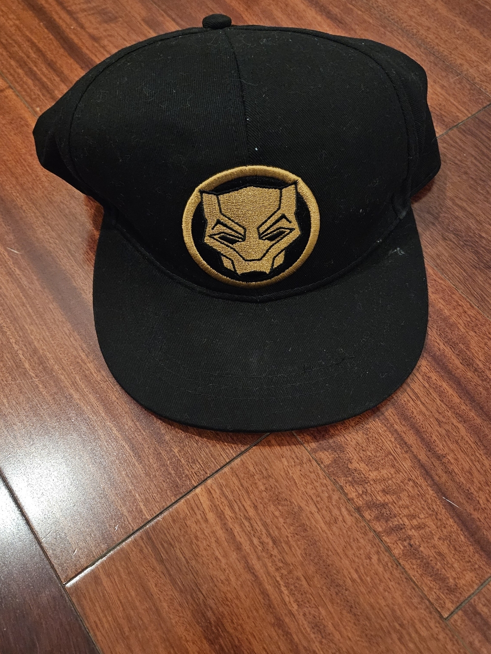 Black Snapback Hat with Gold Black Panther Patch